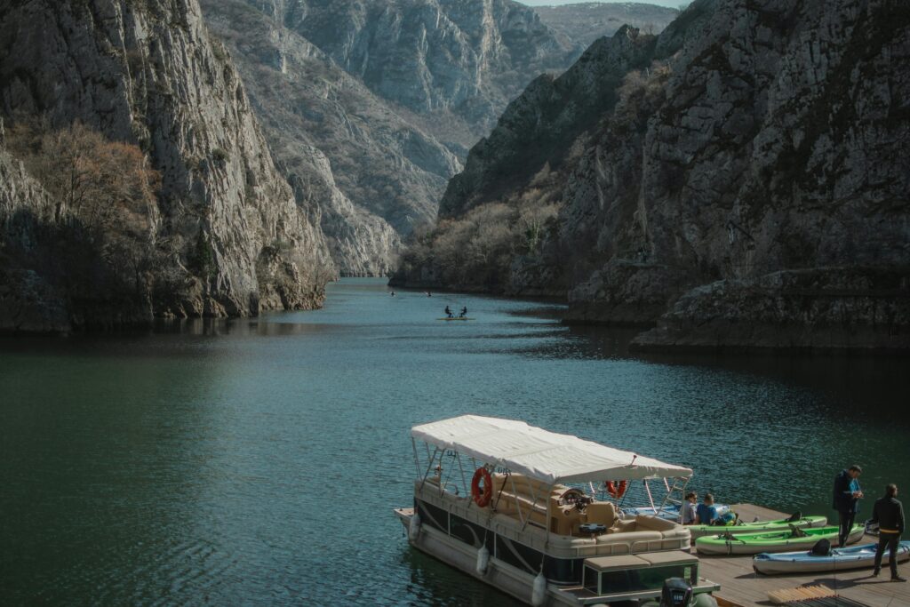 Photo by Atanasija Gulevska: https://www.pexels.com/photo/view-of-a-boat-on-the-lake-in-matka-canyon-skopje-macedonia-15747117/