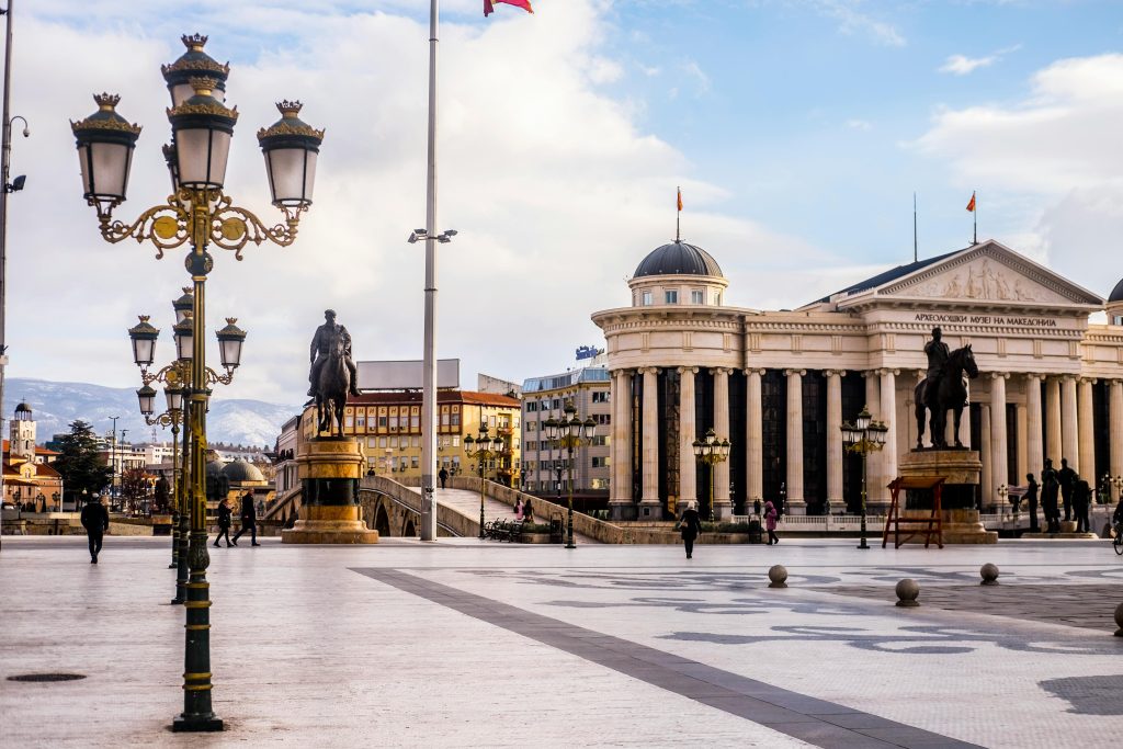 Photo by Tamas Marton: https://www.pexels.com/photo/square-with-sculptures-and-old-national-museum-in-macedonia-4616611/